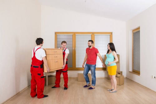Professional movers handling apartment access during a Whitecity relocation